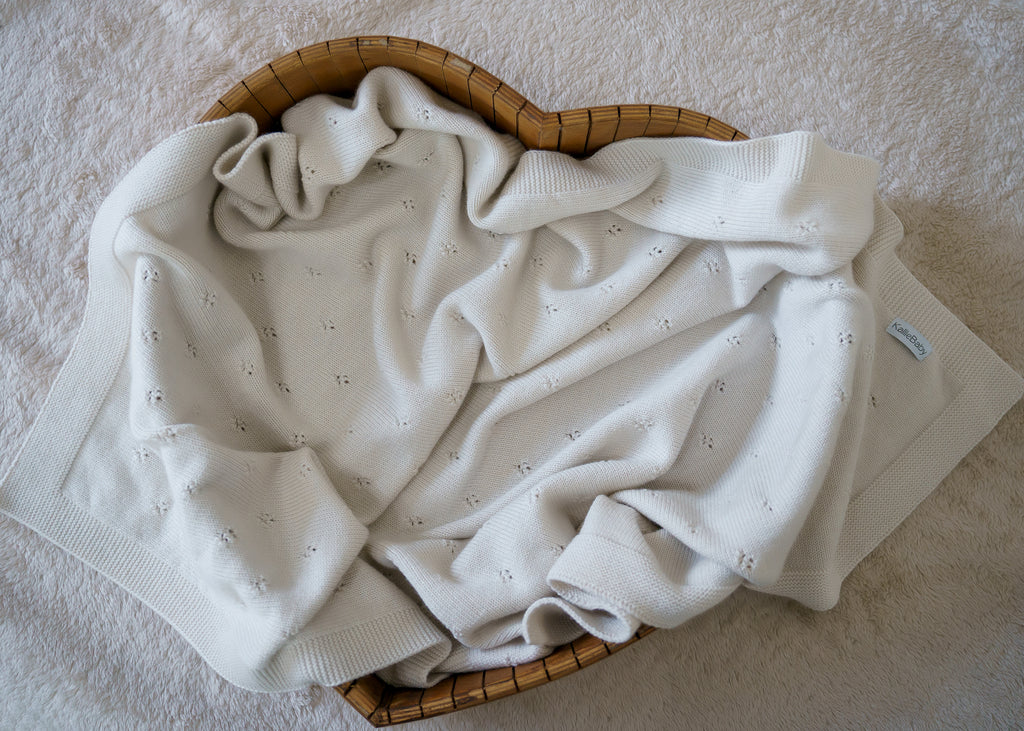 100% RWS-certified merino wool baby blanket. Soft, breathable, and naturally temperature-regulating, this sustainable knit is gentle on delicate skin and perfect for year-round use. The timeless design with subtle pointelle details makes it an heirloom-quality piece – ideal for cuddles, sleep, or as a thoughtful baby shower gift.