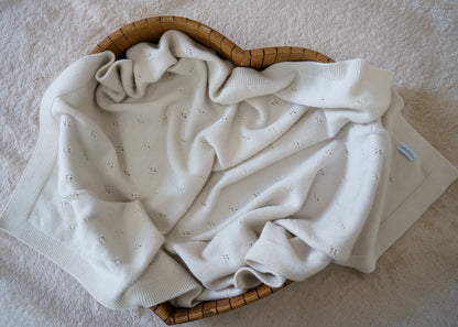 100% RWS-certified merino wool baby blanket. Soft, breathable, and naturally temperature-regulating, this sustainable knit is gentle on delicate skin and perfect for year-round use. The timeless design with subtle pointelle details makes it an heirloom-quality piece – ideal for cuddles, sleep, or as a thoughtful baby shower gift.